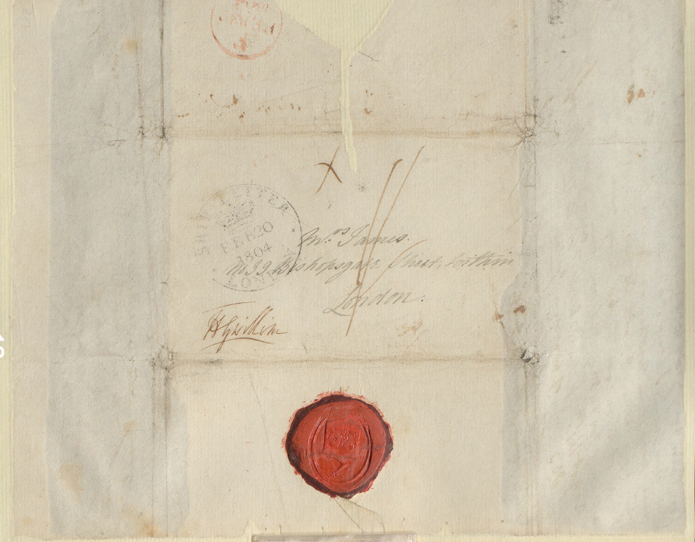 A handwritten address on a square sheet of paper with a red circular seal at bottom and lines showing four foldmarks.